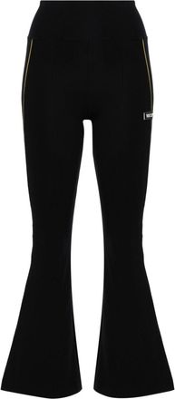 Versace logo-appliqu&eacute; flared leggings - women - Polyamide/Elastane - S - Black