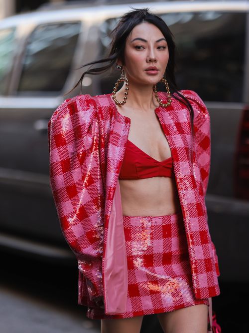 jessica wang in red and pink two-piece outfit