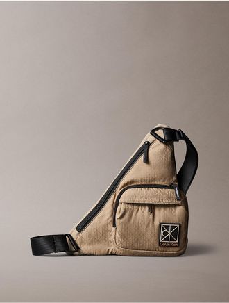 Calvin Klein Mens Allover Emblem Logo Utility Sling Bag - Brown