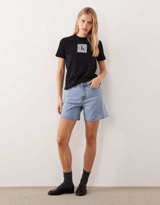 Calvin Klein Jeans Pantaloncini di jeans svasati a vita alta lavaggio blu chiaro