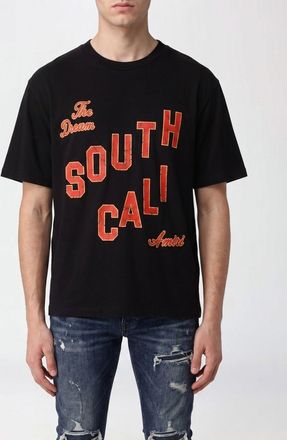 Amiri T-shirt stile vintage in cotone con stampa slogan e spalle cadute