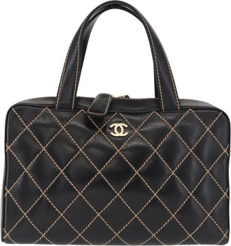 Chanel Surpique Boston Quilted Leather Black Leather Handbag (Pre-Owned)