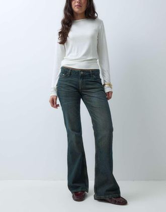 Weekday Nova jeans slim flare a vita bassa in lavaggio blu polveroso scuro