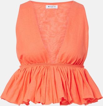 Alaia Ala&iuml;a Peplum striped cotton and linen top