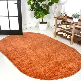 Jonathan Y Designs Haze Solid Low-Pile Oval Area Rug in Coral-Orange at Nordstrom, Size 4Ft 0In X 6Ft 0In