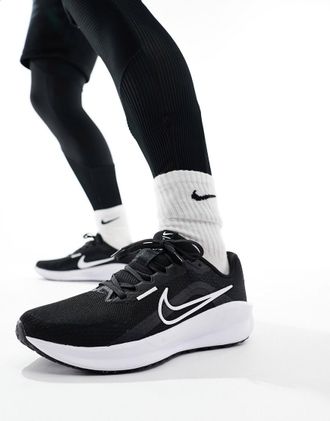 Nike Downshifter 13 sneakers in black and white