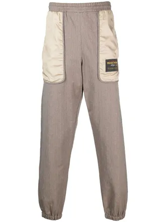 Moschino logo-patch panelled track pants - men - Cotton/Polyamide/Polyamide - 44 - Brown