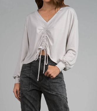 Elan V-Neck Long Sleeve Cinched Front Top In Stone