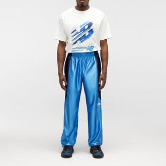 New Balance Hombre Basketball Warmup Pant en Azul, Poly Knit, Talla L