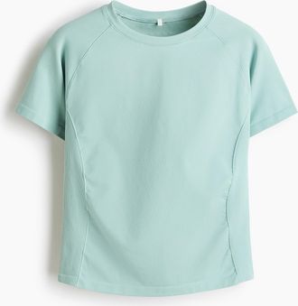 H&M Nahtloses Sport-T-Shirt mit DryMove in Slim Fit - Turquoise