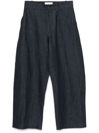 STUDIO NICHOLSON curved-leg trousers - Blue