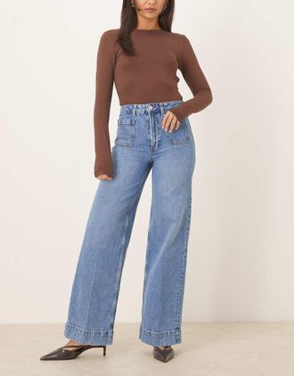 Asos Jeans a vita alta con fondo ampio lavaggio midwash con tasche sul davanti-Blu