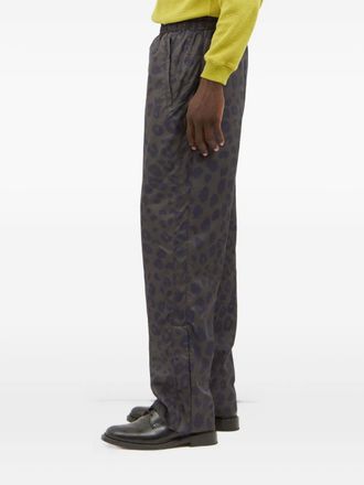 Metalwood Studio animal-print zip-cuff trousers - Black