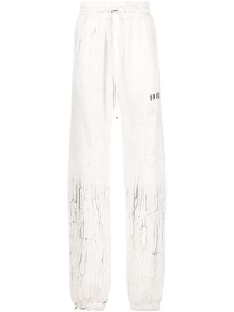 Amiri cracked-print track pants - White