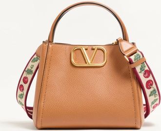 Valentino Garavani Valentino Garavani Alltime medium handbag in grainy calfskin with Cherryfic embroidered ribbon shoulder strap. Wo