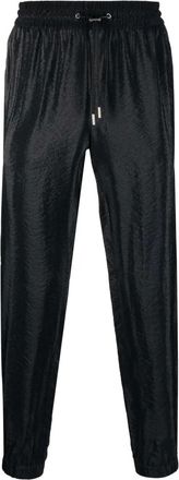 Saint Laurent side-stripe tapered trousers - men - Silk/Viscose/Polyester - 50 - Black