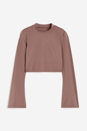H&M Cropped Sportshirt aus SoftMove - Beige