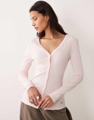 Calvin Klein Jeans Top a maniche lunghe color rosa confetto a coste con bottoni sul davanti