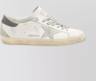 Golden Goose distressed leather sneakers featuring suede star