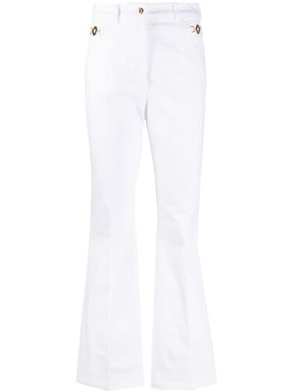 Patou logo-embroidered flared jeans - White