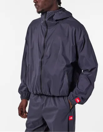 The North Face Mens Redbox Packable Windbreaker Jacket Black Clothing > Coats &