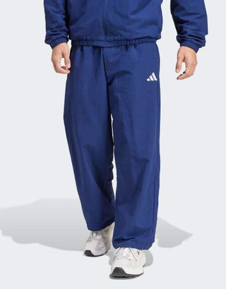 adidas adidas Performance - Essential - Pantaloni blu scuro e bianchi con logo piccolo e fondo aperto