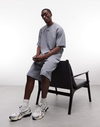 Rains 41390 - Pantaloncini ampi blu a nido dape con coulisse e logo in coordinato