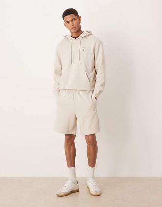 Calvin Klein Jeans Pantaloncini in spugna color crema con stemma-Bianco