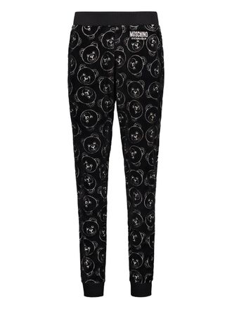 Moschino all-over print trousers - Black