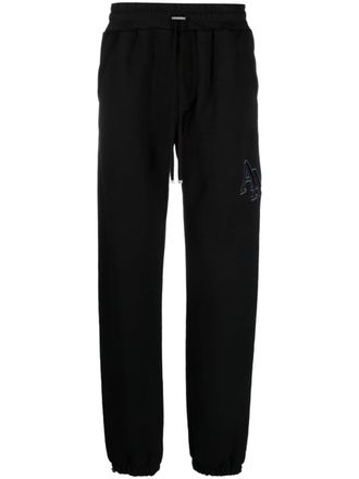 Amiri Staggered logo-embroidered track pants - Black