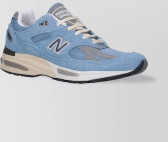 New Balance low top sneakers with mesh panels and suede overlays