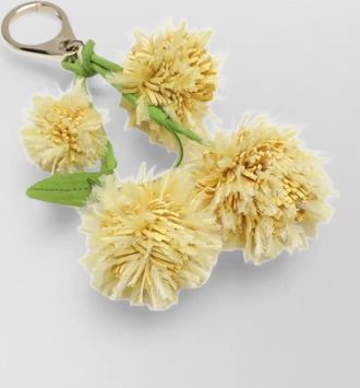 Christian Louboutin brass bag charm