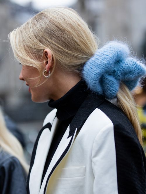 Andrea Steen seen wearing blue knitted scrunchie outside Lovechild 1979 during Copenhagen Fashion Week Autumn/Winter 2022 on February 01, 2022 in Copenhagen, Denmark.
