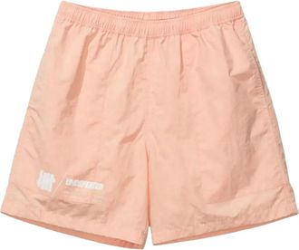 Undefeated logo-print tie-dye shorts - Orange
