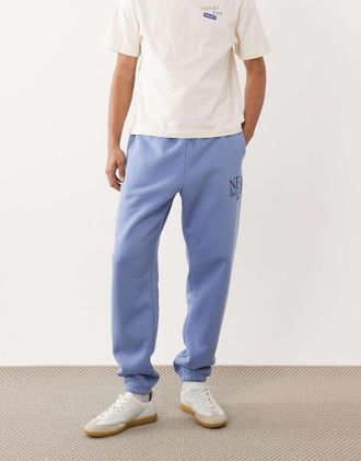 New Balance Reimagined - Joggers in felpa blu