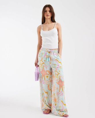 Never Fully Dressed Pantaloni da mare blu con stampa di sole