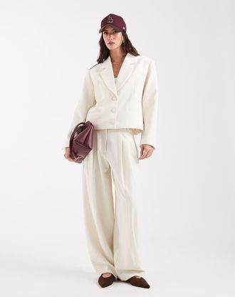 Asos Pantaloni sartoriali a vita bassa extra larghi a palloncino color panna-Bianco