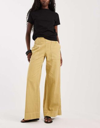 Free People Pantaloni freschi a zampa a vita bassa color senape-Giallo
