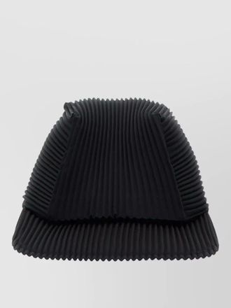 Homme Pliss&eacute; Issey Miyake pleated cap curved brim structured silhouette