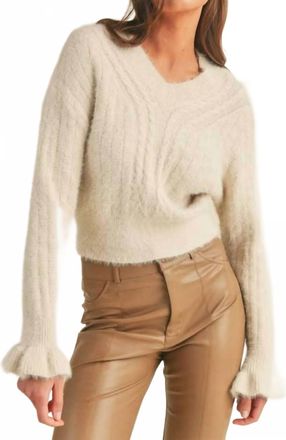Merci Woven Knit Sweater With Flutter Cuff In Ivory