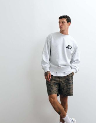 Carhartt Work in Progress Travon - Pantaloncini in nylon con stampa animalier-Bianco