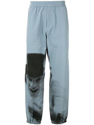 Undercover A Clockwork Orange print track pants - Blue