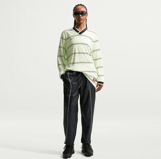 Nike Womens Nike Sportswear Mid-Rise Repel Woven Pants in Black | IM8483-010