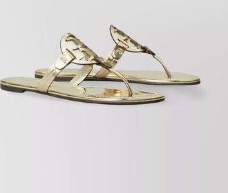 Tory Burch gold sandals with flat sole and metallic finish
