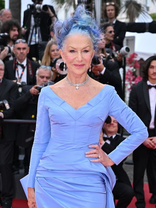 Helen Mirren wears a blue dress with matching blue hair