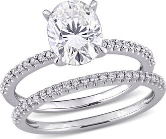 Amour 2 CT DEW Oval Created Moissanite and 1/4 CT TW Diamond Bridal Ring Set In 14K White Gold