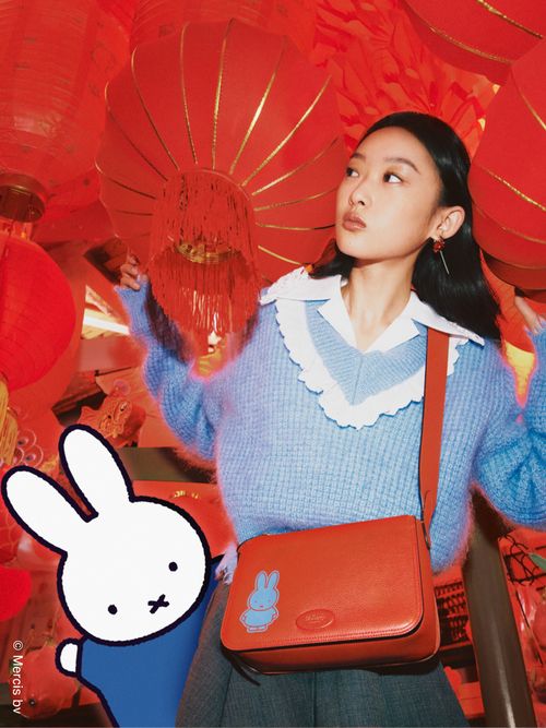Model wears red bag from the Mulberry x Miffy collaboration