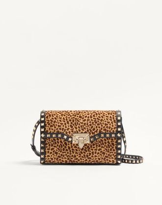 Valentino Garavani Valentino Garavani Rockstud small shoulder bag in pony-effect calfskin with animal print Wo