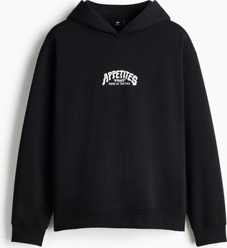 H&M Bedruckter Hoodie in Relaxed Fit - Schwarz