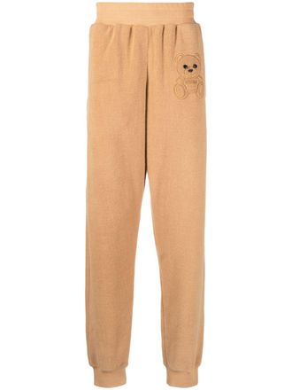 Moschino embroidered-teddy fleece track pants - men - Cotton - 48 - Brown